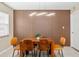 Charming dining room with wood accent wall and stylish light fixture at 5519 Homewood Dr, Sarasota, FL 34232