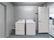 Laundry room featuring a modern washer, dryer, and storage space at 5519 Homewood Dr, Sarasota, FL 34232