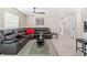 Comfortable living room featuring a reclining sectional, decorative rug, and ceiling fan at 5519 Homewood Dr, Sarasota, FL 34232