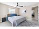 Cozy main bedroom features a queen bed, a modern ceiling fan, and stylish decor at 5519 Homewood Dr, Sarasota, FL 34232