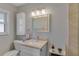 Bathroom featuring granite countertops, vanity and updated lighting fixtures at 5591 15Th N Ave, St Petersburg, FL 33710