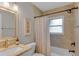 Modern bathroom with a neutral palette and shower-tub combination at 5591 15Th N Ave, St Petersburg, FL 33710