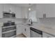 Well-equipped kitchen with granite countertops and a stylish faucet at 5591 15Th N Ave, St Petersburg, FL 33710