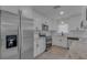 Modern kitchen featuring white cabinets, stainless steel appliances, granite countertops, and a sleek subway tile backsplash at 5591 15Th N Ave, St Petersburg, FL 33710