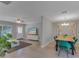 Open concept living area flowing into the dining space, complete with modern furniture, stylish decor, and plenty of natural light at 5591 15Th N Ave, St Petersburg, FL 33710