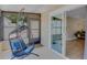 Relaxing sunroom with tile floors, hanging chair and sliding glass doors at 5591 15Th N Ave, St Petersburg, FL 33710