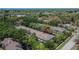 A stunning aerial view showcasing the building's architecture and the green landscape of the surrounding area at 5864 Nature Terrace Cv, Tampa, FL 33617