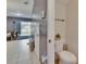 Cozy half-bath features tiled floors and an adjacent living space with sliding glass doors at 5864 Nature Terrace Cv, Tampa, FL 33617