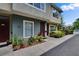 Townhome exterior showing the front door, window, and neat front yard landscaping at 5864 Nature Terrace Cv, Tampa, FL 33617