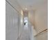 Hallway featuring carpet flooring, closet doors, and a view to the adjacent living space at 5864 Nature Terrace Cv, Tampa, FL 33617