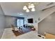 Bright and open living space featuring tile flooring, staircase, and sliding glass doors at 5864 Nature Terrace Cv, Tampa, FL 33617