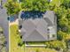 Aerial view of the house with a new roof and screened in patio at 6130 Japonica Ct, New Port Richey, FL 34655