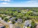 An aerial view of the neighborhood showing mature landscaping and trees at 6130 Japonica Ct, New Port Richey, FL 34655