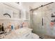Chic bathroom with marble vanity, glass shower, and modern fixtures throughout at 6130 Japonica Ct, New Port Richey, FL 34655