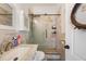Elegant bathroom featuring a glass shower, marble vanity, and modern fixtures throughout at 6130 Japonica Ct, New Port Richey, FL 34655