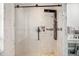 Modern bathroom featuring a frameless glass shower with sleek black trim and fixtures at 6130 Japonica Ct, New Port Richey, FL 34655