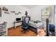 Bedroom with wood floors and desk space, ideal for study and rest, awaiting personalization at 6130 Japonica Ct, New Port Richey, FL 34655