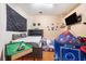 Bright bedroom with a mini pool table, gray walls and a cool play tent at 6130 Japonica Ct, New Port Richey, FL 34655