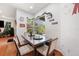 Cozy dining area with a large window overlooking the backyard at 6130 Japonica Ct, New Port Richey, FL 34655
