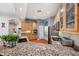 Bright kitchen boasts granite counters, wood cabinets, and a stainless steel refrigerator at 6130 Japonica Ct, New Port Richey, FL 34655