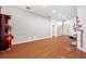 Bright living room with hardwood floors, recessed lighting, and view of the front door at 6130 Japonica Ct, New Port Richey, FL 34655