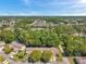 A bird's-eye view of the community with its beautiful landscaping and tranquil pond at 6428 Remus Dr, New Port Richey, FL 34653