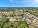 Panoramic aerial view of the residential area surrounded by lush trees and well-maintained lawns at 6428 Remus Dr, New Port Richey, FL 34653