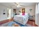Bright bedroom with a bed and a glimpse into the ensuite bathroom at 6428 Remus Dr, New Port Richey, FL 34653