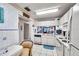 Cozy kitchen nook with a tile backsplash, white appliances, and lots of counterspace at 6428 Remus Dr, New Port Richey, FL 34653