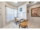 Bright kitchen nook features a small table, two chairs and a large window at 6428 Remus Dr, New Port Richey, FL 34653