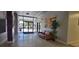 A lobby with tile floors, an art piece, and a seating area near the entrance at 701 S Madison Ave # 316, Clearwater, FL 33756