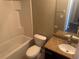 Bathroom featuring a tub and shower combination and a granite topped vanity at 778 Spring Flowers Trl, Brandon, FL 33511