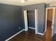 Clean bedroom featuring hardwood flooring and a closet with sliding doors at 778 Spring Flowers Trl, Brandon, FL 33511