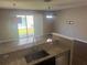 Bright dining area with hardwood floors and sliding glass door to backyard at 778 Spring Flowers Trl, Brandon, FL 33511