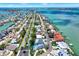 Stunning aerial view of waterfront homes with private docks and a canal leading to open water at 7800 Causeway N Blvd, St Petersburg, FL 33707