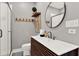 Modern bathroom featuring a unique vanity, round mirror, and glass shower at 7800 Causeway N Blvd, St Petersburg, FL 33707