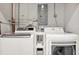 Bright laundry room featuring a modern washer and dryer set against a neutral-colored wall at 7800 Causeway N Blvd, St Petersburg, FL 33707