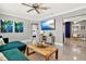 Comfortable living room with modern decor, stylish furniture, and a mounted television at 7800 Causeway N Blvd, St Petersburg, FL 33707