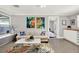 Bright and airy living room featuring a cozy sofa, stylish coffee table, and art-adorned walls at 7800 Causeway N Blvd, St Petersburg, FL 33707
