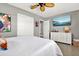 Bright main bedroom with white dresser and TV at 7800 Causeway N Blvd, St Petersburg, FL 33707