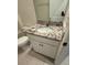 Bathroom showcasing a granite countertop vanity and tiled flooring at 7937 Wheat Stone Dr, Zephyrhills, FL 33540