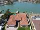 Stunning waterfront property with a private pool, dock, and lush landscaping at 8053 13Th S Ave, St Petersburg, FL 33707