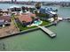 Beautiful waterfront property with a private pool, dock, and lush landscaping at 8053 13Th S Ave, St Petersburg, FL 33707