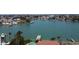 Waterfront home featuring a private dock, pool, and lush landscaping at 8053 13Th S Ave, St Petersburg, FL 33707