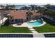 Spacious backyard with a pool, a dock, and lush landscaping for outdoor enjoyment at 8053 13Th S Ave, St Petersburg, FL 33707