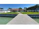 Waterfront home with a dock, a pool and a patio at 8053 13Th S Ave, St Petersburg, FL 33707