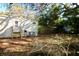Side of home with stairs, siding, back yard with mature tree coverage and new fencing at 9161 Codel Loop, New Port Richey, FL 34654