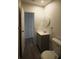 Bathroom features a single vanity, toilet, and a view to another room at 9161 Codel Loop, New Port Richey, FL 34654