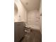 Bathroom features modern vanity, toilet, and a walk-in shower with a built-in seat at 9161 Codel Loop, New Port Richey, FL 34654