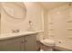 Bathroom with sleek vanity, toilet, and walk-in shower featuring built-in shelves at 9161 Codel Loop, New Port Richey, FL 34654